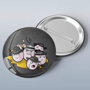 Photo of a button with art of the Pokémon Exeggecute dressed as mobsters, wearing fedoras and holding tommy guns.