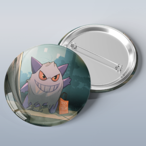 Photo of a button with art of the ghost Pokémon Gengar dressed as a sheet ghost for Halloween trick or treating.